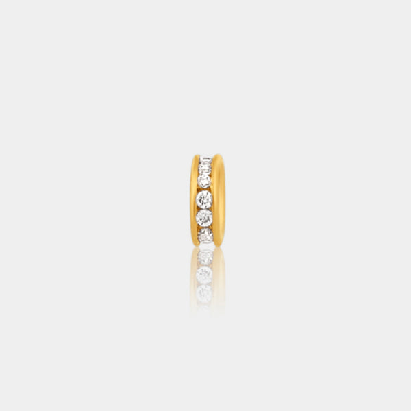 gold pave spacer roundel bead on a light grey background