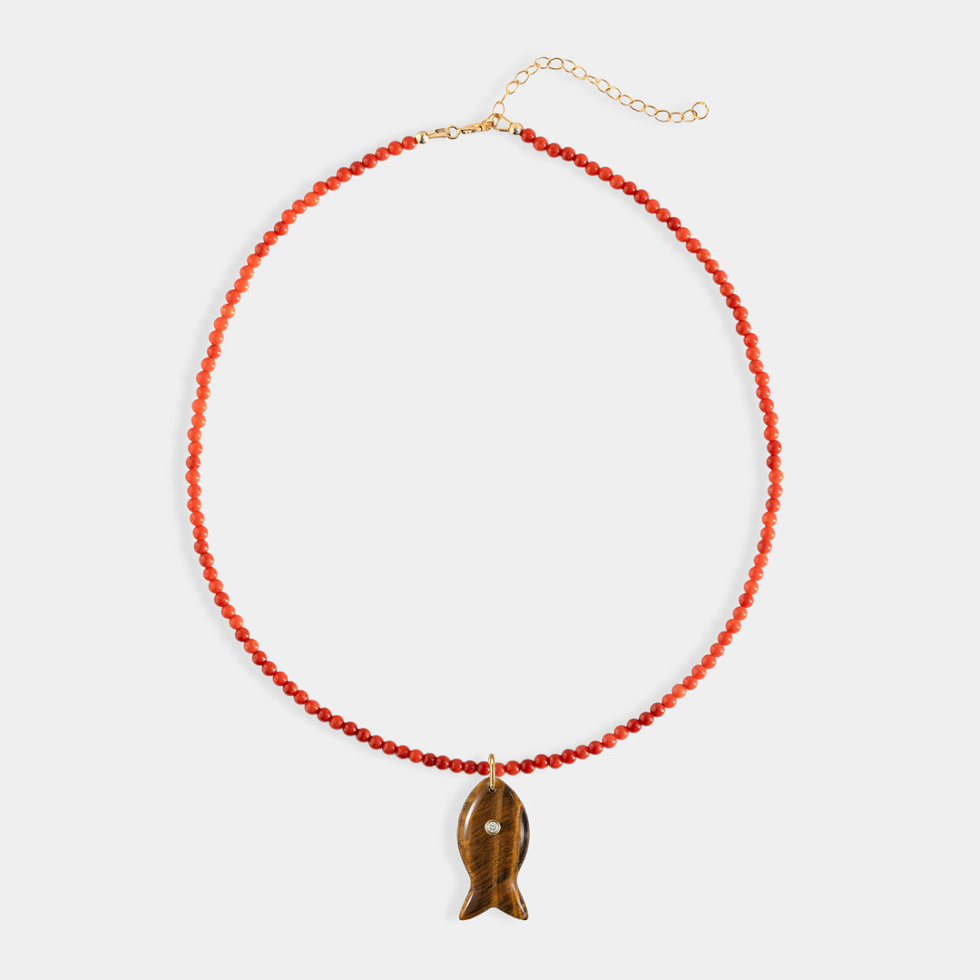 Red stone bead necklace with large carved tiger's eye charm