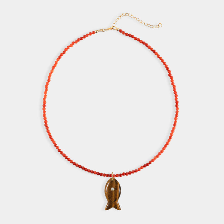 Red stone bead necklace with large carved tiger's eye charm