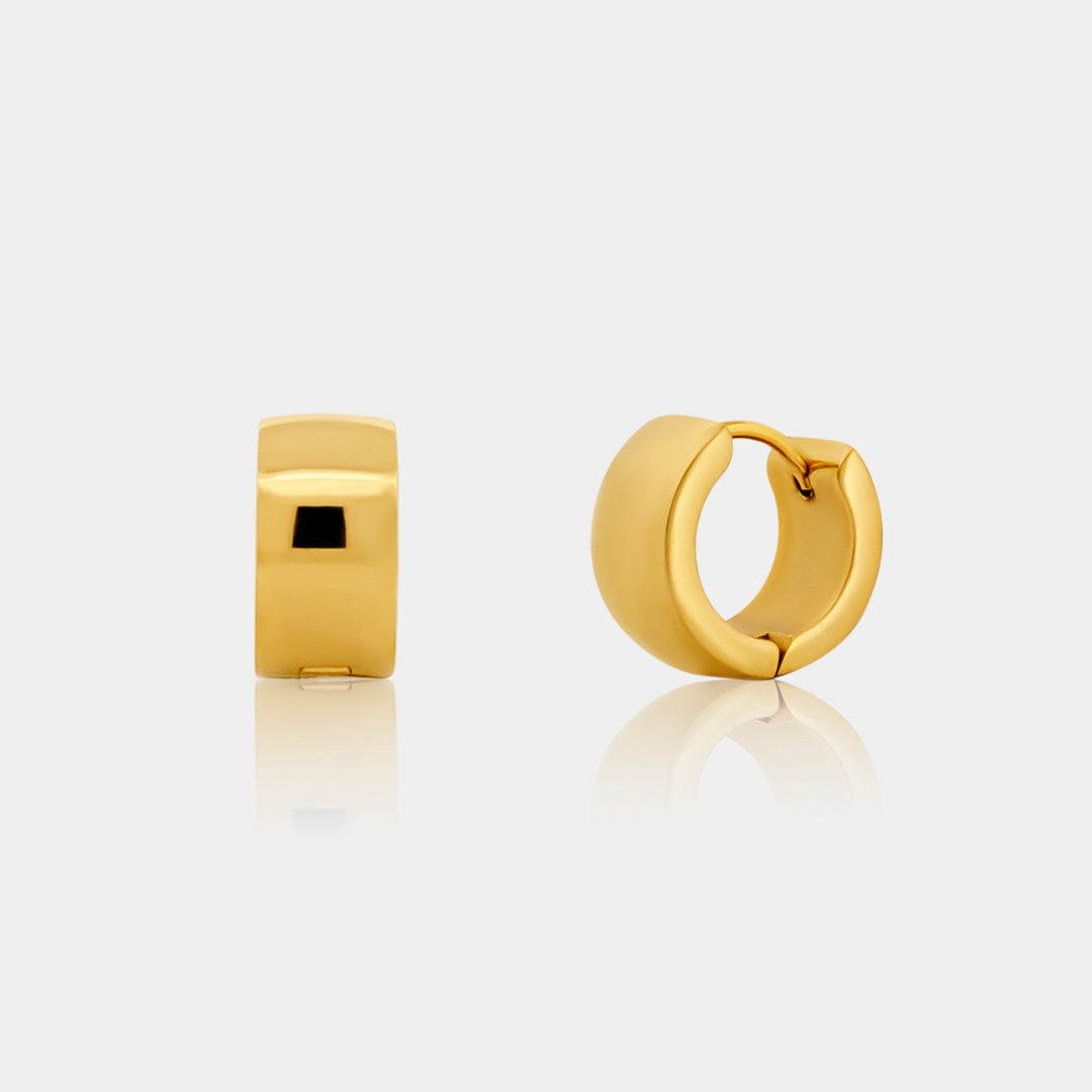mini chunky gold huggies on a grey background
