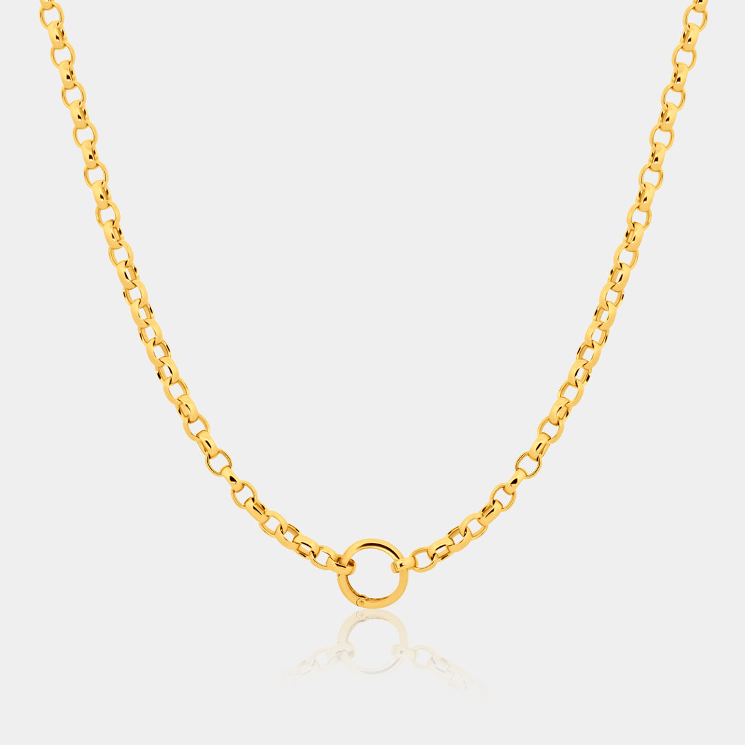 Gold chain necklace with a small round pendant on a light gray background