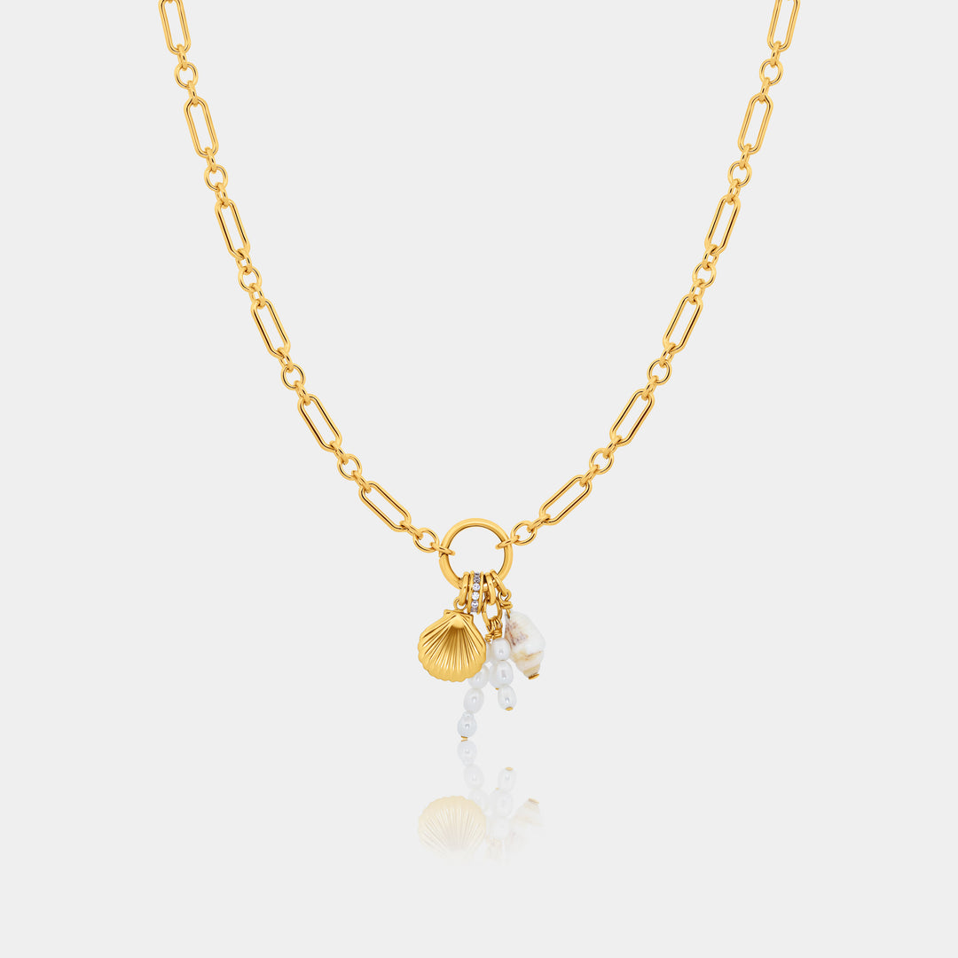 14k gold fill long and short necklace with shell and pearl charm part of the charm edit on a gray background