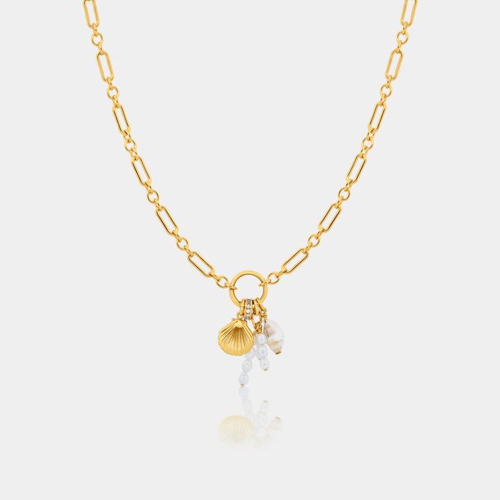 14k gold fill long and short necklace with shell and pearl charm part of the charm edit on a gray background