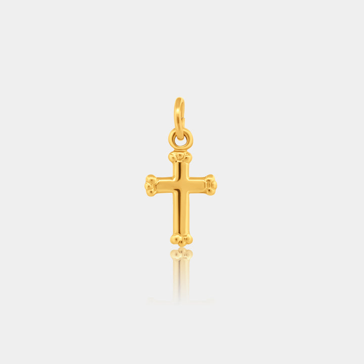 14k gold filled cross charm on a light gray background