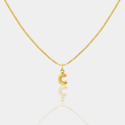 Gold necklace with a letter "C" Initial pendant on a white background
