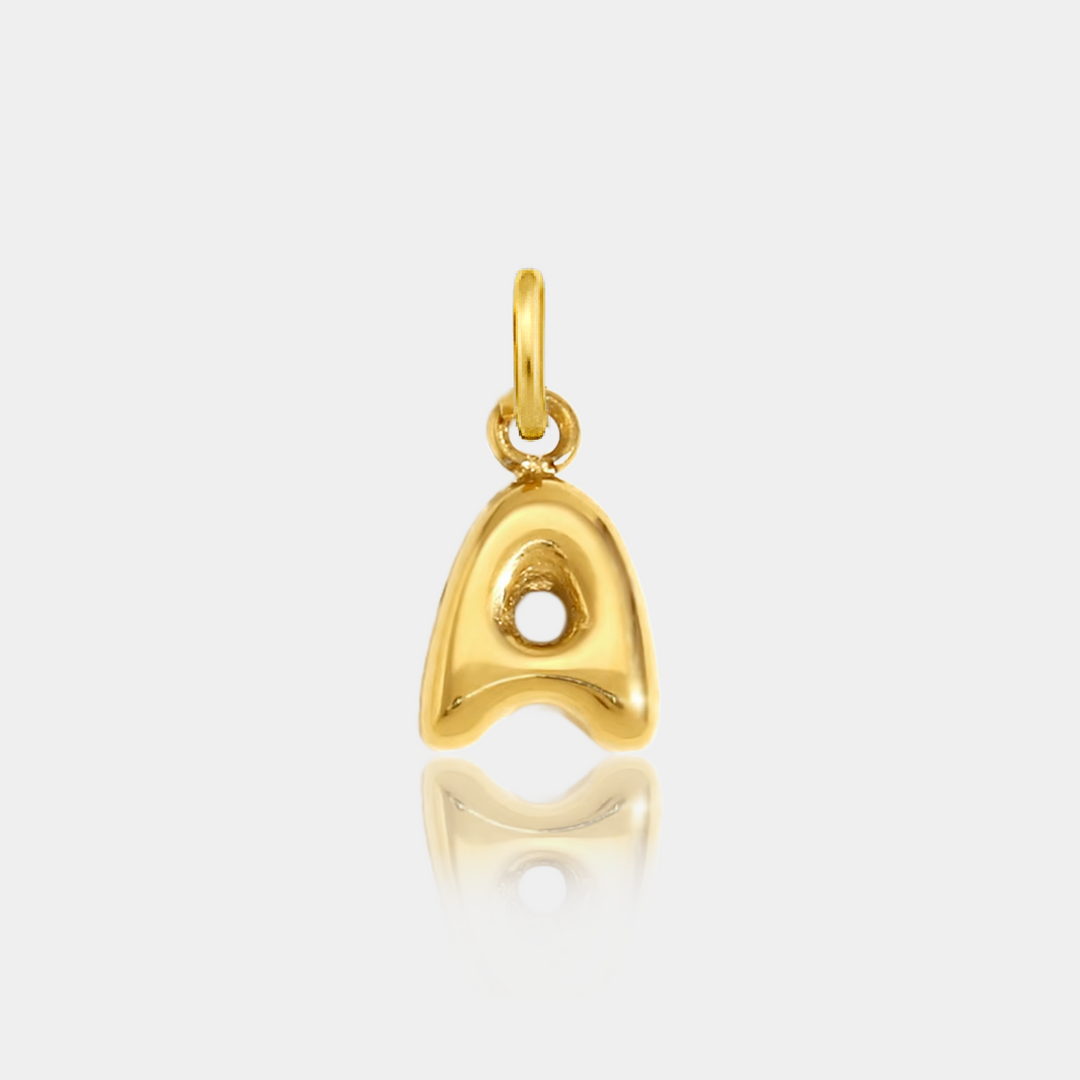Gold pendant of initial letter A on a light gray background