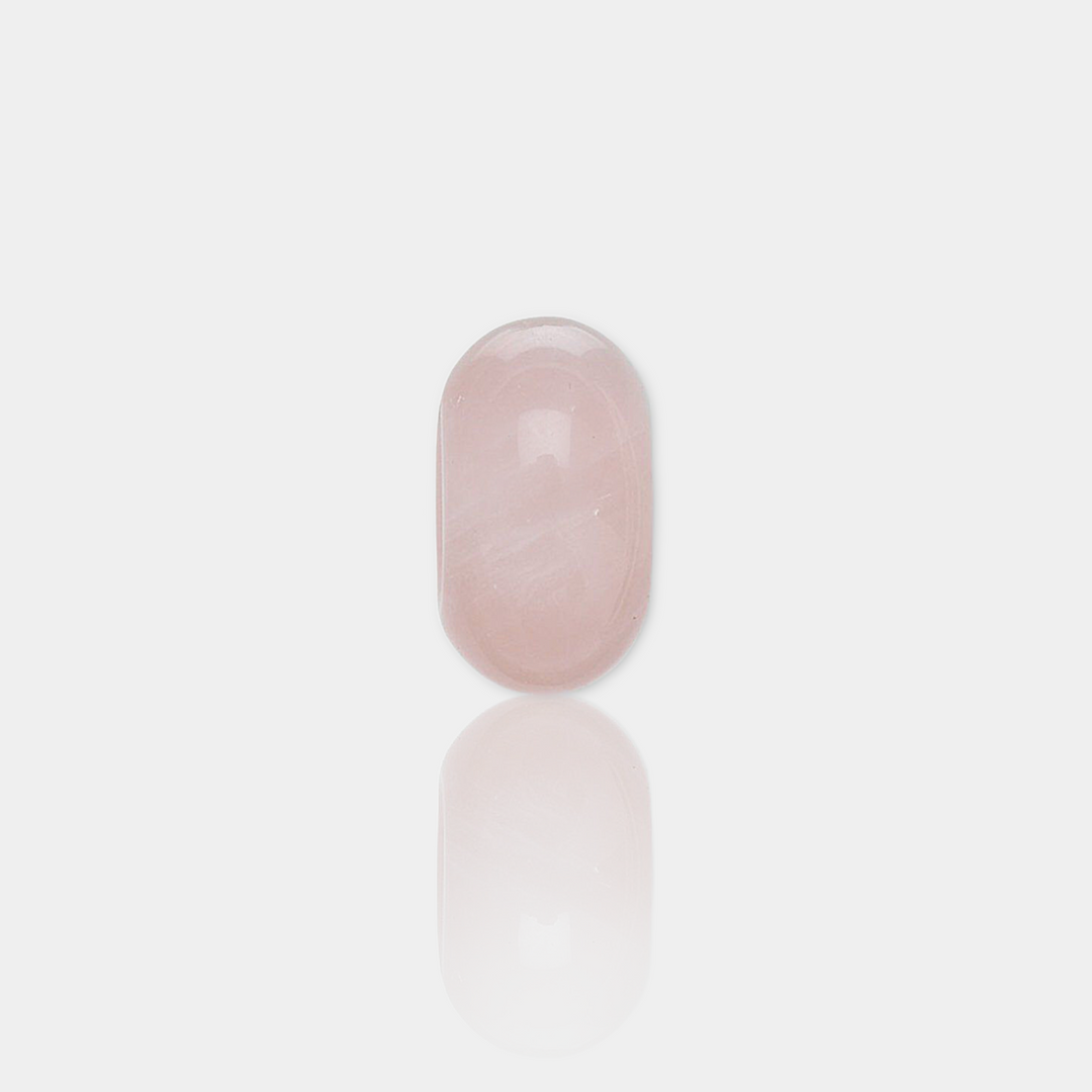 rose quartz spacer bead on a light gray background