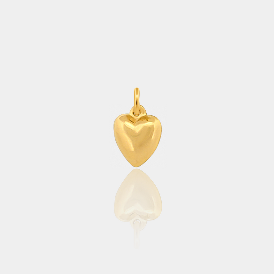 Gold heart-shaped pendant on a light gray background